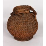 A POLYNESIAN POT, POSSIBLY FIJIAN, 19TH/20TH CENTURY. Clay pot and cover with handle, extensively