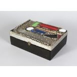 A JEWELLERY BOX, set with semi precious stones 9in long