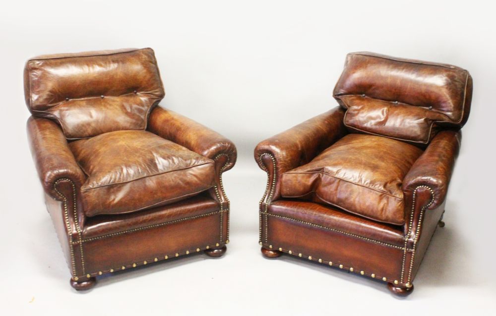 A GOOD PAIR OF BROWN LEATHER CLUB ARMCHAIRS, with button upholstered backs, deep loose seat