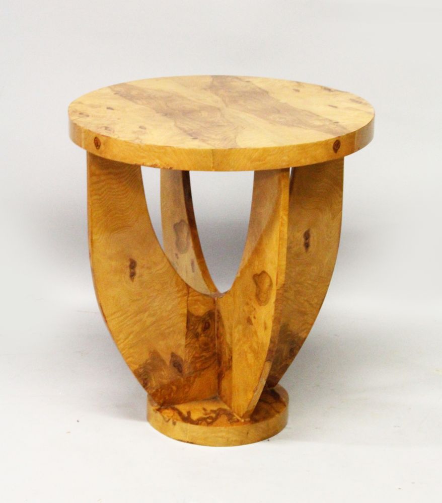 AN ART DECO STYLE CIRCULAR BURR WOOD CIRCULAR COFFEE TABLE. with curving support on a circular