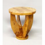 AN ART DECO STYLE CIRCULAR BURR WOOD CIRCULAR COFFEE TABLE. with curving support on a circular