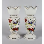 A GOOD PAIR OF VICTORIAN FROSTED VASES, painted with birds and flowers in brilliant colours. 11ins