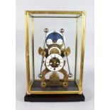 A GOOD SKELETON CLOCK, 20TH CENTURY, with moon phase movement in a glass case 1ft 8in high