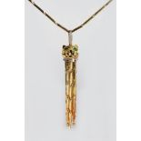 A GOOD 18ct GOLD "CARTIER" PANTHER PENDANT, set with diamonds and rubies with nine tassels on an