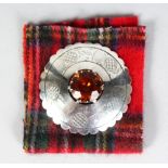 A LARGE SCOTTISH SILVER BROOCH, set with a Cairngorm