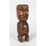 A MAORI, CARVED GABLE FIGURE, NEW ZEALAND Tekoteko. With paua shell eyes. 6 1/4 ins in height.