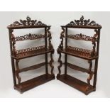 A SUPERB PAIR OF LATE REGENCY MAHOGANY STANDING OPEN BOOKCASES, with open backs three tiers with