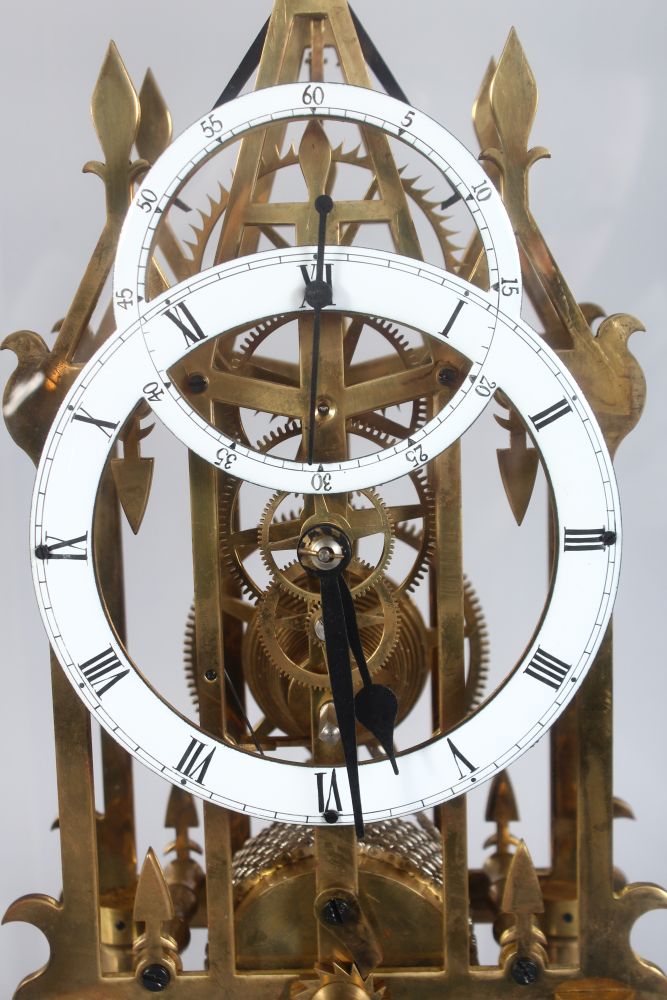 A GOOD CATHEDRAL STYLE SKELETON CLOCK, 20TH CENTURY, in a glass case, 1ft 9in high - Image 2 of 3