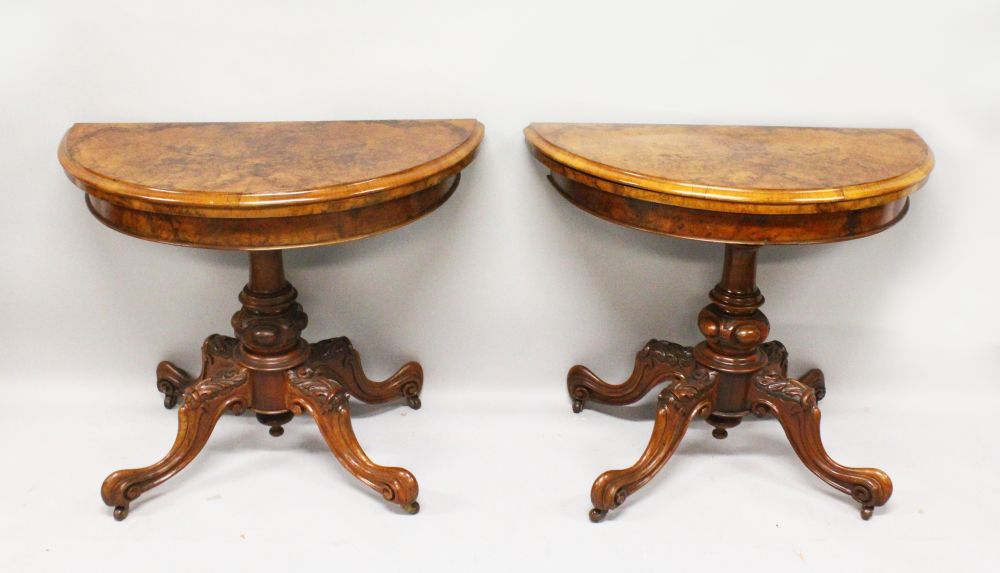 A GOOD PAIR OF VICTORIAN FIGURED WALNUT DEMI-LUNE CARD TABLES, with folding tops, green baize - Image 2 of 2