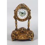 A SUPERB FRENCH SILVER GILT MUSICAL TABLE CLOCK, the case inset with pearls, sapphires and rubies