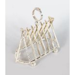 A PLATED TOAST RACK MODELLED AS CRICKET BATS