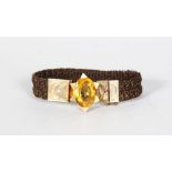 A SCOTTISH HUMAN HAIR AND GOLD MOUNTED BRACELET