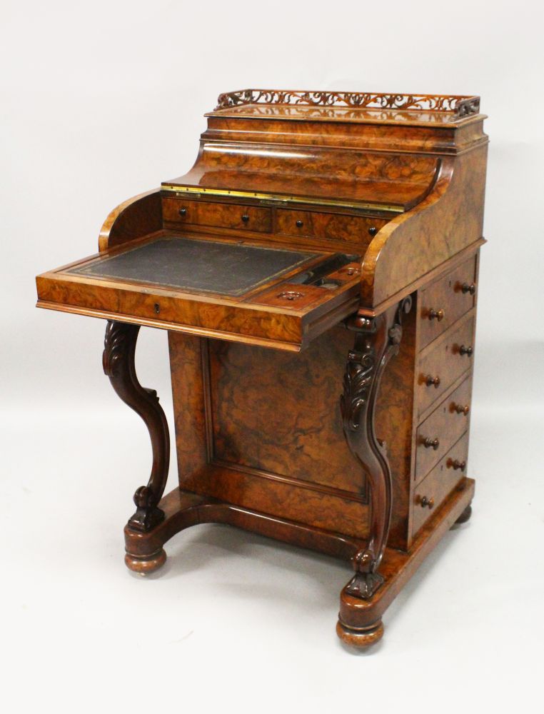 A GOOD 19TH CENTURY FIGURED WALNUT PIANO TOP DAVENPORT of typical form, with fitted interior, four