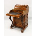 A GOOD 19TH CENTURY FIGURED WALNUT PIANO TOP DAVENPORT of typical form, with fitted interior, four