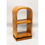 AN ART DECO STYLE BURR WOOD OPEN BOOKCASE. with curving top and a single shelf. 1ft 8in wide x 3ft
