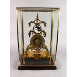 A LARGE SKELETON CLOCK, the brass dial engraved with signs from the zodiac, in a glass case. 2ft