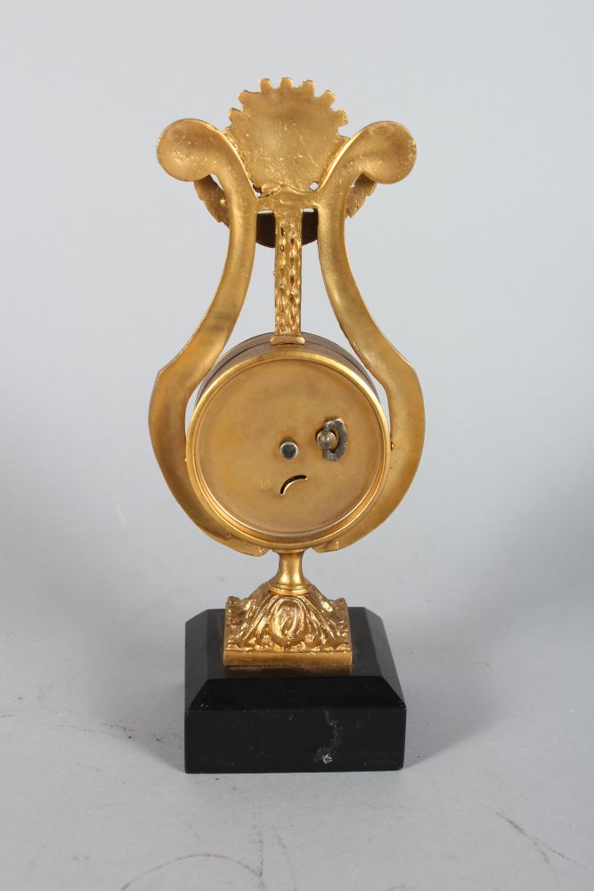 A SMALL GILDED LYRE CLOCK, on a marble base, 8.5in high - Image 2 of 2