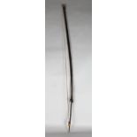 PAPUA NEW GUINEA BOW. Carved wood and bamboo, feathers, bound with fibre and leather. 67ins.