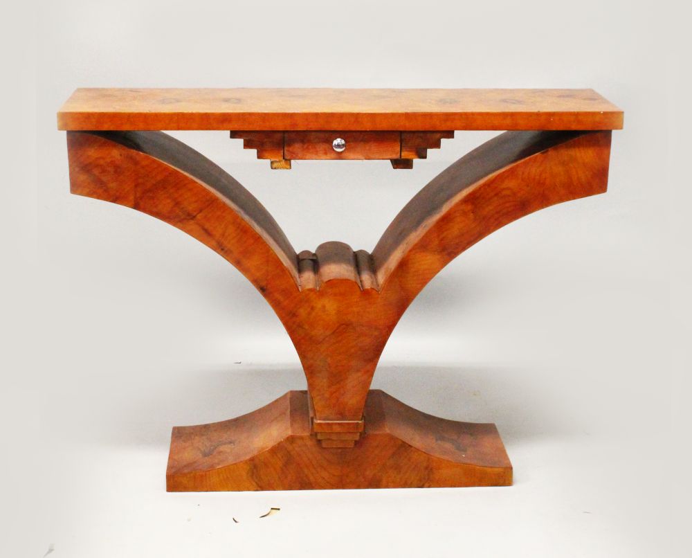 AN ART DECO STYLE BURR WOOD CONSOLE TABLE, with a rectangular top, a small drawer on curving support