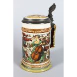 A GOOD METTLACH POTTERY TANKARD, etched with a band of revelling figures playing musical