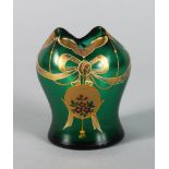 AN ART DECO GREEN AND GILT VASE with ribbons and flowers. 3.5ins high.