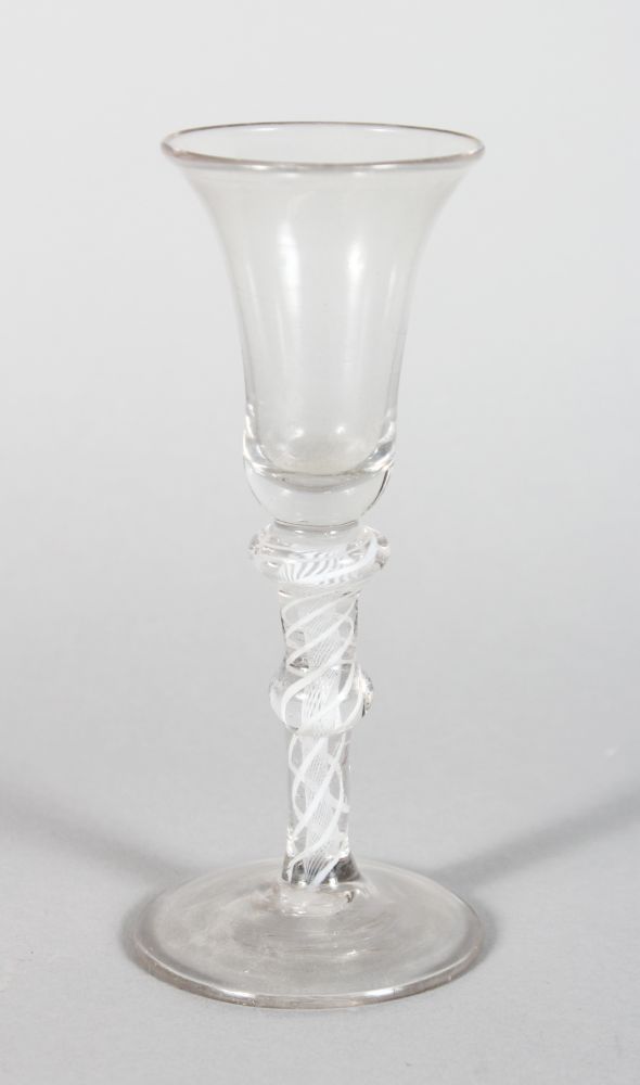 A GEORGIAN WINE GLASS, with inverted bell bowl and air twist knop stem 5.75in high