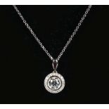 A GOOD DIAMOND PENDANT 0.54cts, SURROUNDED BY SMALL DIAMONDS AND SET IN 18ct WHITE GOLD