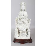 A LARGE CHINESE KANGXI PERIOD BLANC-DE-CHINE PORCELAIN FIGURE OF GUANYIN, together with a fitted