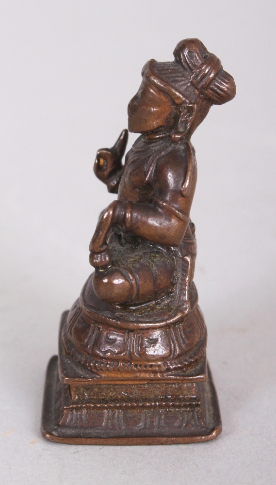 A Bronze Figure of a Tamil Saint, South India, 19th century, the bearded figure seated in - Image 4 of 8