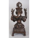 A SMALL 19TH/20TH CENTURY INDIAN BRONZE FIGURE OF GANESH, seated on a square section plinth, 4.9in