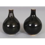 A GOOD PAIR OF 18TH CENTURY CHINESE MONOCHROME MINIATURE PORCELAIN VASES, each applied with a dark