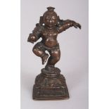 A Bronze Figure of Dancing Krishna, Tamil Nadu, South India, 17th/18th century, the infant deity