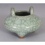 A SMALL CHINESE CELADON CRACKLEGLAZE PORCELAIN TRIPOD CENSER, 3.8in wide at widest point & 2.6in