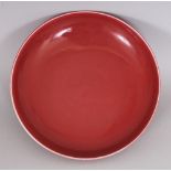 A CHINESE COPPER RED PORCELAIN SAUCER DISH, the base with a six-character Yongzheng mark, 6.9in