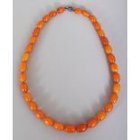 A GOOD BUTTERSCOTCH AMBER NECKLACE, weighing approx. 22.9gm, composed of graduated oval beads,