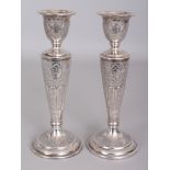 A GOOD PAIR OF EARLY/MID 20TH CENTURY PERSIAN SILVER CANDLESTICKS, weighing approx. 365gm in