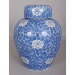 AN EARLY 20TH CENTURY JAPANESE SETO BLUE & WHITE PORCELAIN JAR, & COVER, with an additional fitted