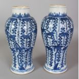 A PAIR OF CHINESE KANGXI PERIOD BLUE & WHITE SQUIRREL & VINE PORCELAIN VASES, circa 1700, 8.75in