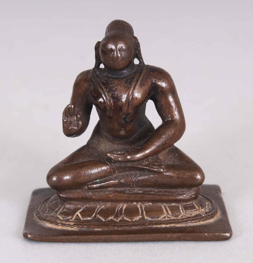 A Small Bronze Figure of a Tamil Saint, South India, 18th/19th century, seated in sattvasana, his