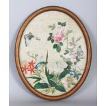 A 19TH CENTURY FRAMED CHINESE OVAL PAINTING ON RICE PAPER, depicting butterflies in flight above