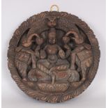 A Carved Wood Roundel, South India, late 20th century, depicting Gajalakshmi in relief, 30cm (11 3/