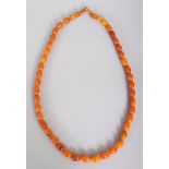 ANOTHER GOOD BUTTERSCOTCH AMBER NECKLACE, weighing approx. 34gm, composed of graduated oval beads,