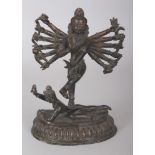 A 19TH CENTURY INDIAN TWO-SECTION BRONZE FIGURE OF MULTI-ARMED SHIVA, dancing on a prostrate