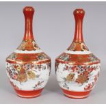 A PAIR OF EARLY 20TH CENTURY JAPANESE KUTANI PORCELAIN BOTTLE VASES, with sloping shoulders and