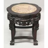 A 19TH/20TH CENTURY CHINESE PINK MARBLE TOP HARDWOOD STAND, with octofoil top surface and pierced