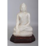 AN 18TH/19TH CENTURY BURMESE CARVED WHITE MARBLE FIGURE OF BUDDHA, mounted on a fixed wood stand,