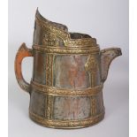 A GOOD 19TH CENTURY TIBETAN BRASS ONLAID AND SILVERED COPPER MONK'S CAP DHALACHA EWER, the