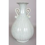 A CHINESE SONG STYLE CELADON FLUTED PORCELAIN VASE, with scroll handles, 12.6in high.