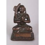 A Small Bronze Figure of Ramanuja, Tamil Nadu, South India, 19th century, seated in sattvasana,