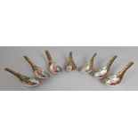 A GROUP OF SEVEN 19TH CENTURY CHINESE CANTON PORCELAIN SPOONS, each 5in long. (7)